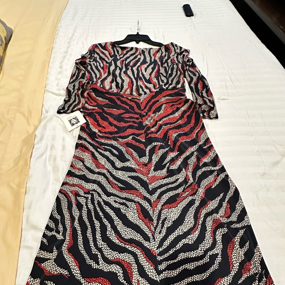 Elegant Zebra Print Dress size 10, Sleeves are 3/4 length.Pit to Pit 19”